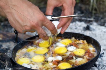 Fried eggs. Cooking on the fire