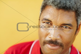 portrait of hispanic mature man staring at camera
