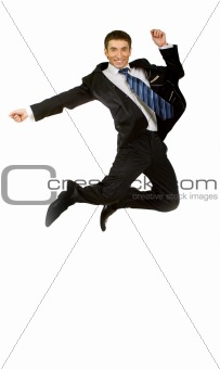 Happy businessman jumping in air against isolated white