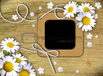 Vintage photo frames and white daisies