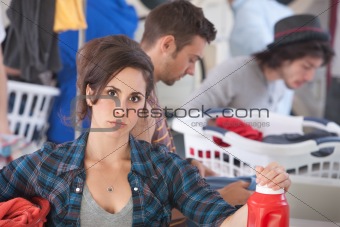 Serious Woman In Laundromat