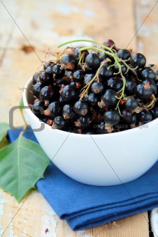black currants ripe and natural on a wooden table