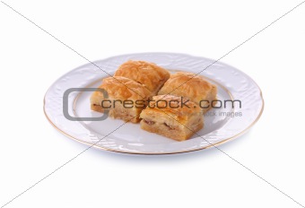 Turkish traditional dessert Baklava served in porcelain dish isolated on white with clipping path