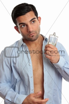 Man with cologne while dressing