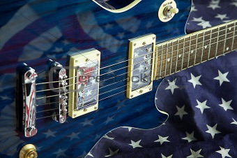 Blue Guitar on Flag Background