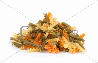 Uncooked pasta fusilli in different colours