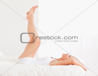 Attractive woman with the legs up