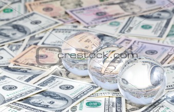 Three crystal spheres against money