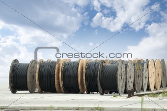 Large rolls of black cables