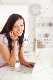 Woman with laptop looking