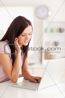 Woman looking at keyboard of laptop