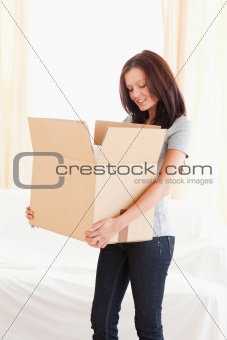 Woman looking into cardboard