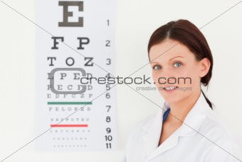 Female optician with eye test