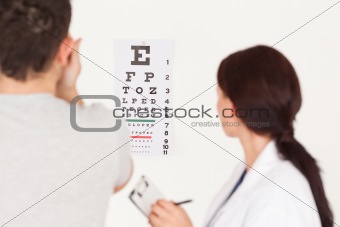 Female optician and patient