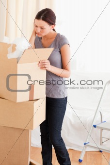 Woman searching in a cardboard