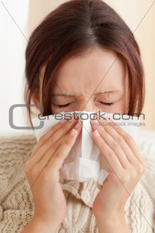 Sneezing young woman