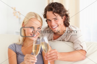 Lovely couple making a toast