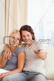 Portrait of a couple watching TV