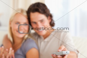 Close up of a young couple watching TV