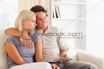 Cute couple watching TV