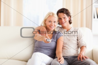 Lovely couple watching TV
