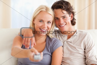 Close up of a cute couple watching TV