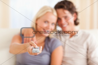 Happy couple watching TV