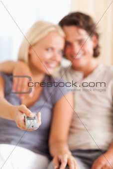 Portrait of a happy couple watching TV