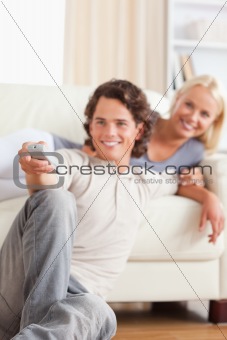 Portrait of a couple watching the television