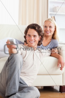 Portrait of a cute couple watching the television