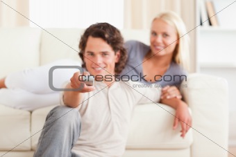 Smiling couple watching the television