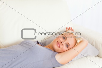 Close up of a woman lying on a sofa