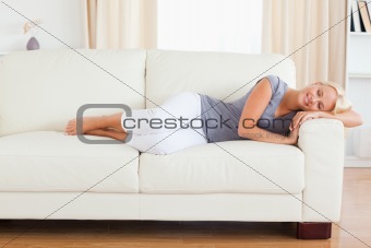 Calm woman resting on a sofa