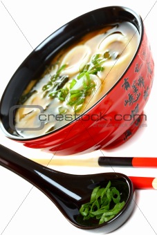 Miso soup with seafood and green onions.