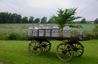 Old milk cans on waggon
