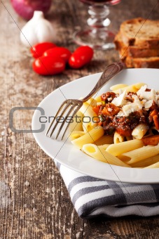penne bolognese and parmigiano cheese
