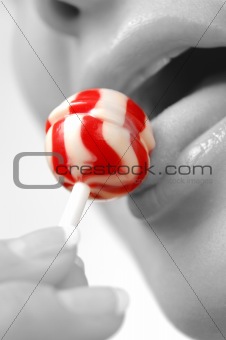 Girl licking a lollipop