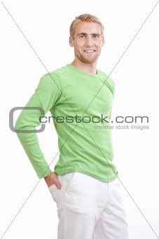 portrait of a young man with blond hair in green top smiling - isolated on white