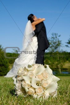 Wedding bouquet and couple