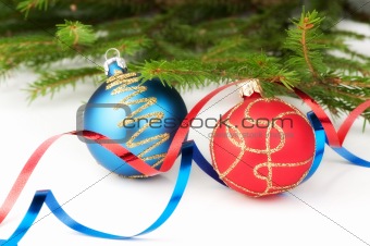 Christmas baubles with curly ribbon and christmas tree