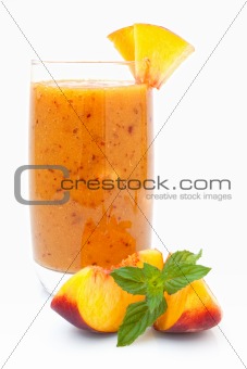 Peach cocktail with mint leaves