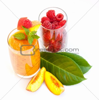 Peach cocktail with mint leaves and raspberries