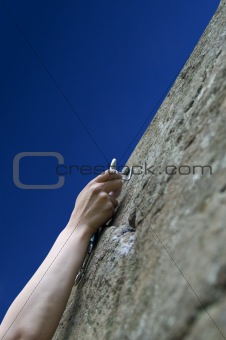 Climber's hand with quick-draws