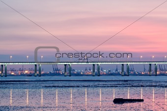 sunset in hongkong and highway bridge and container pier