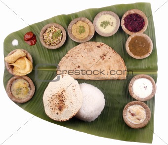 South indian lunch on banana leaf with clipping mask