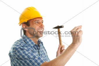 Confident worker wearing hard hat and hammering in