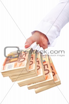 Stacks of euros in woman hand - isolated