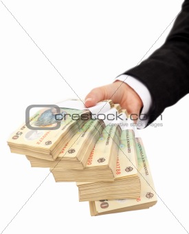 Hand holding stack of romanian currency