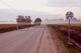 early morning mist and road