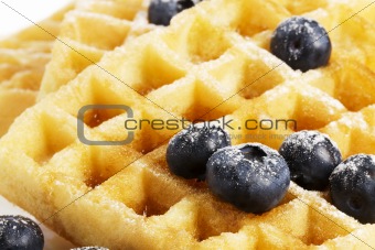 waffles with blueberries and syrup